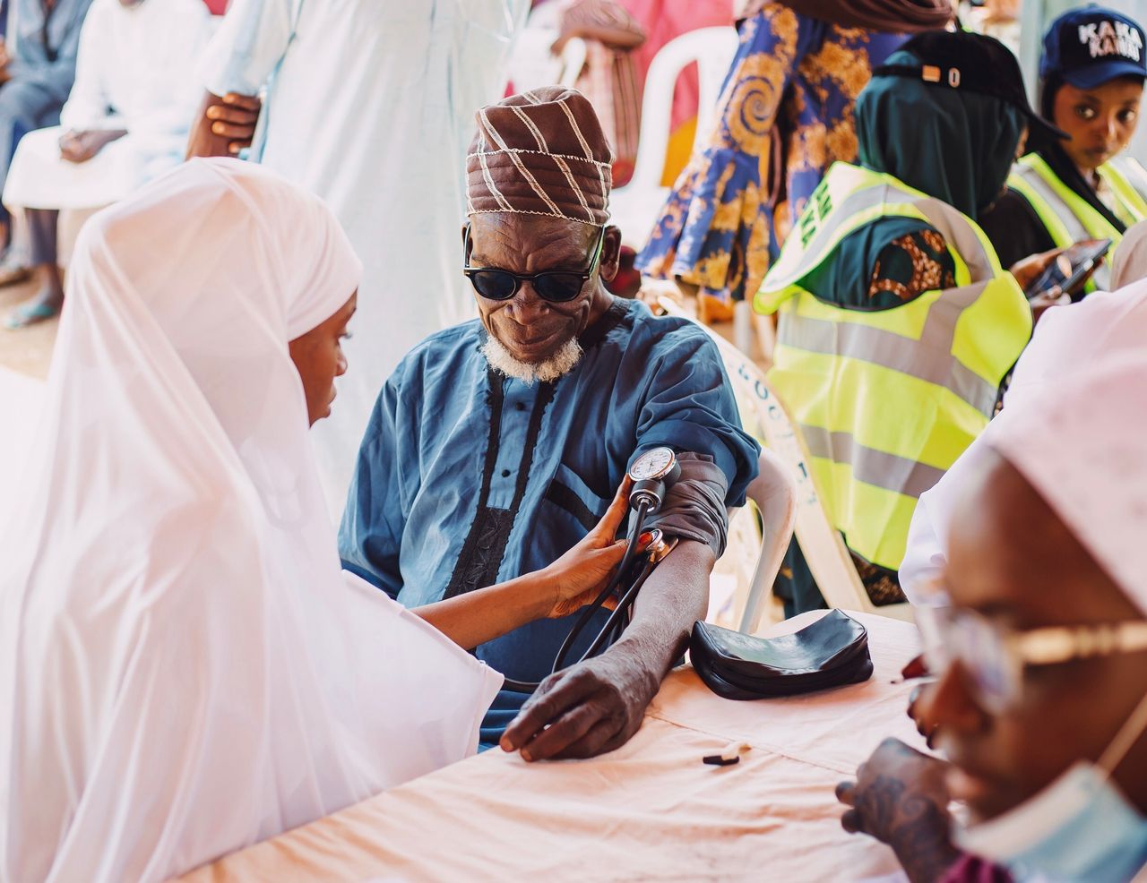 why-choose-us Elderly man receives medical care during community health outreach in Kaduna, Nigeria.