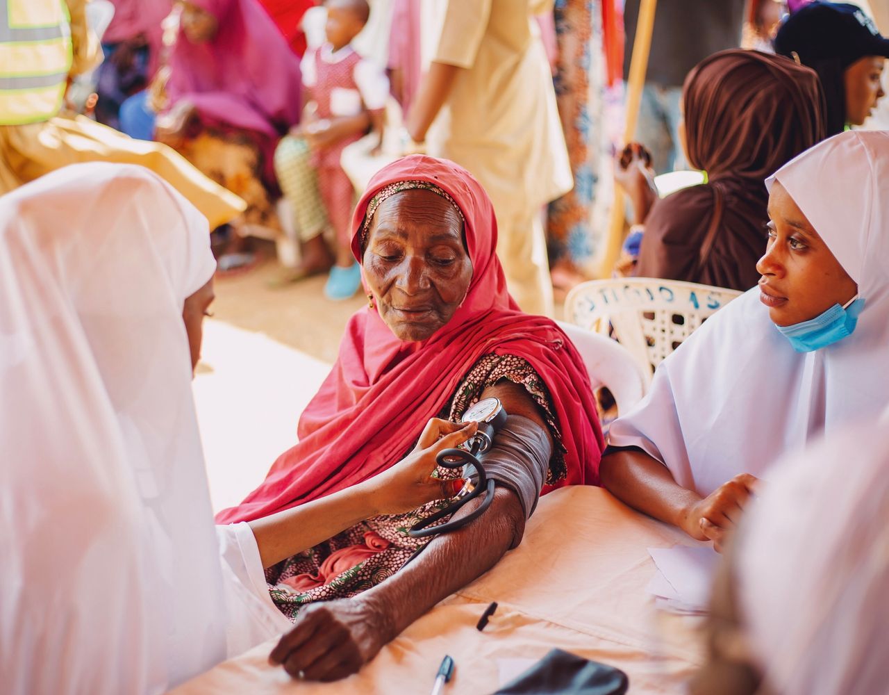 gallery-2 An outdoor health checkup for the elderly in Kaduna, Nigeria, emphasizing community care.