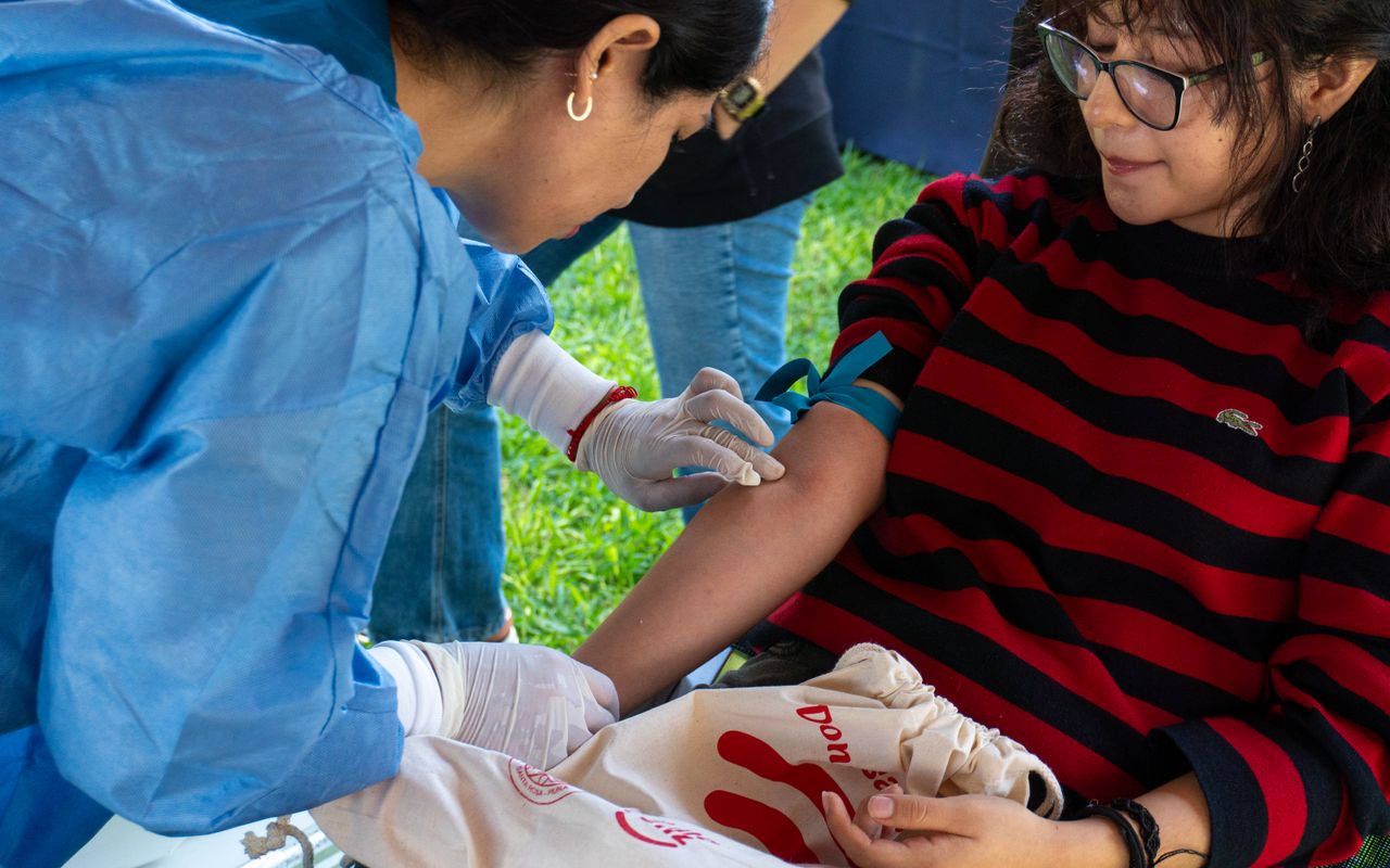 gallery-1 A donor giving blood at an outdoor donation event in Piura, Peru.